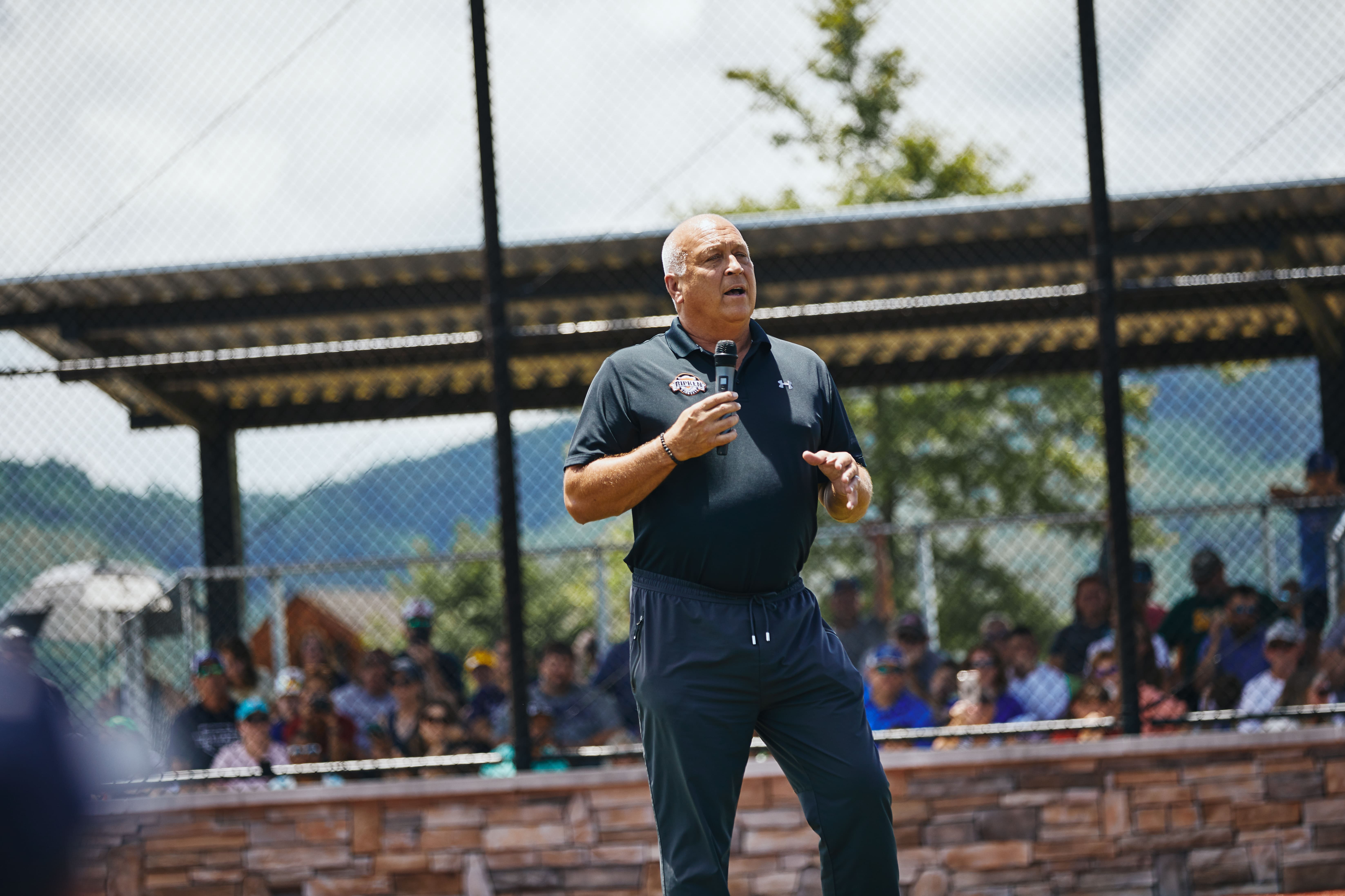 Cal Ripken Jr. talking on microphone at The Ripken Experience™ Pigeon Forge