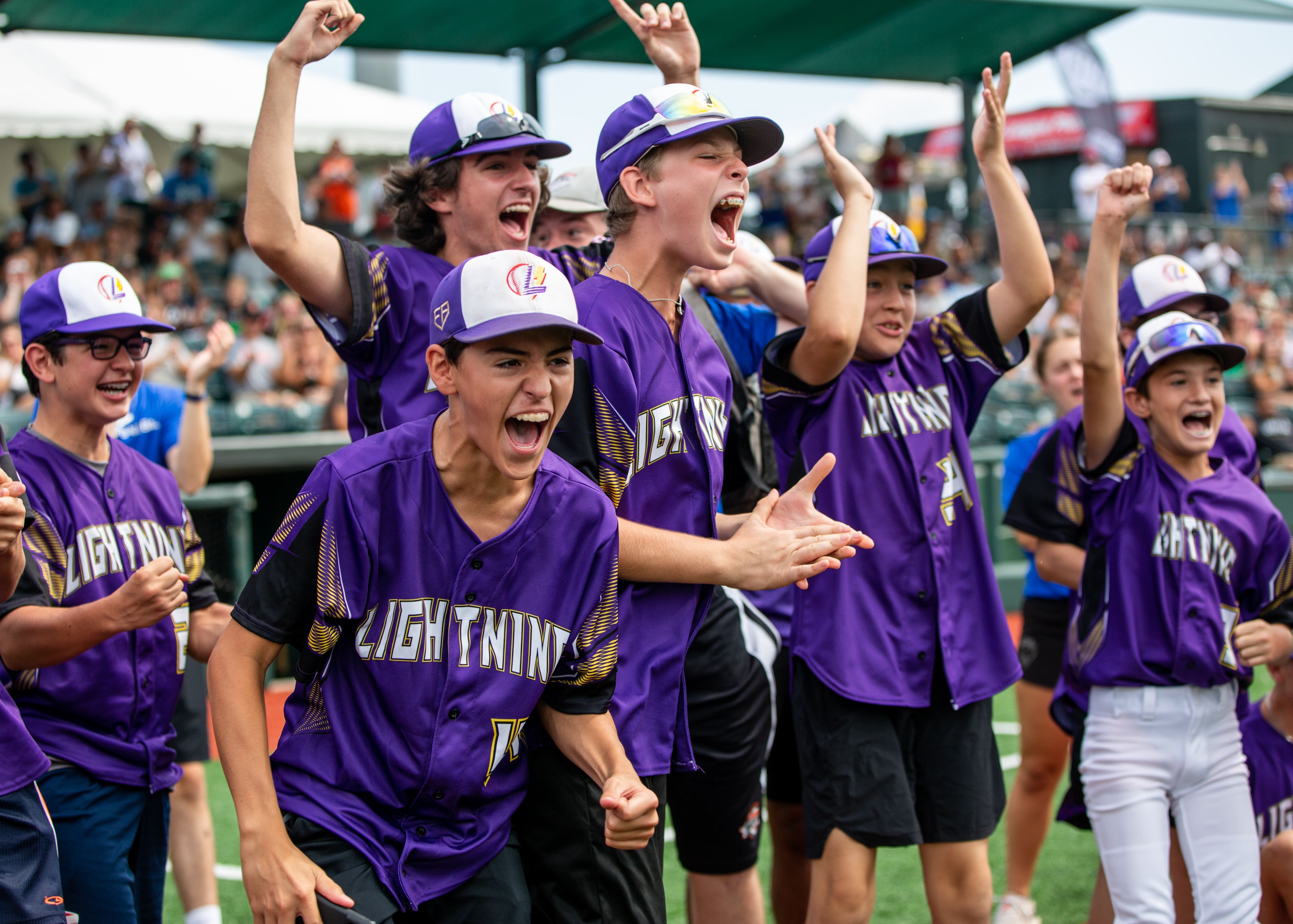 baseball players cheering at a tournament at The Ripken Experience™ Aberdeen