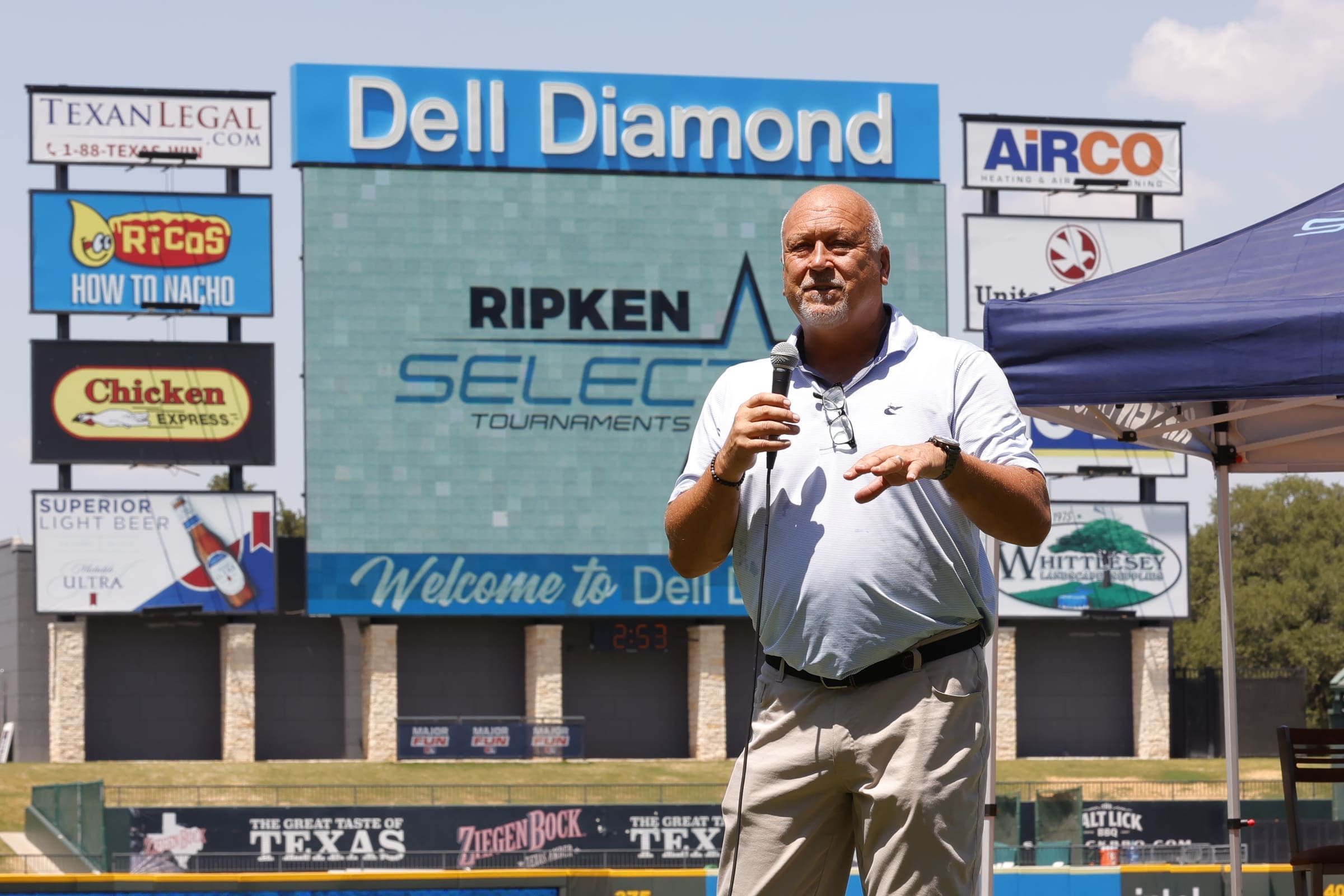 Cal Ripken Jr. talking to baseball players at the Ripken Select Tournament in Round Rock, Texas